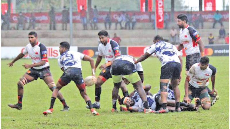 Action at the Kandy-Navy match