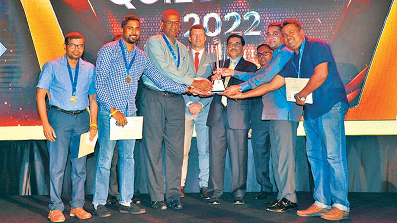 The winners of the quiz competition. Here the Seylan Bank team receives the award from Dr. Nandalal Weerasinghe