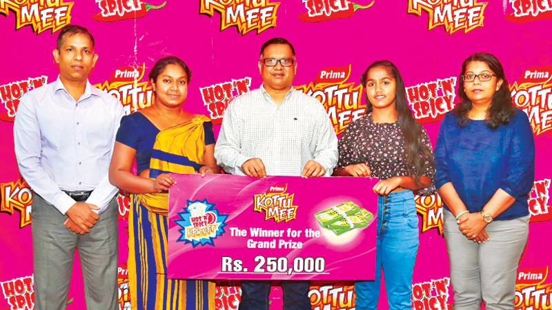 From left: Senior Business Manager Donovan Ondaatje, Deputy General Manager, Sajith Gunaratne and Marketing Manager Himpa Gunawardana with the two Rs. 250,000 winners  