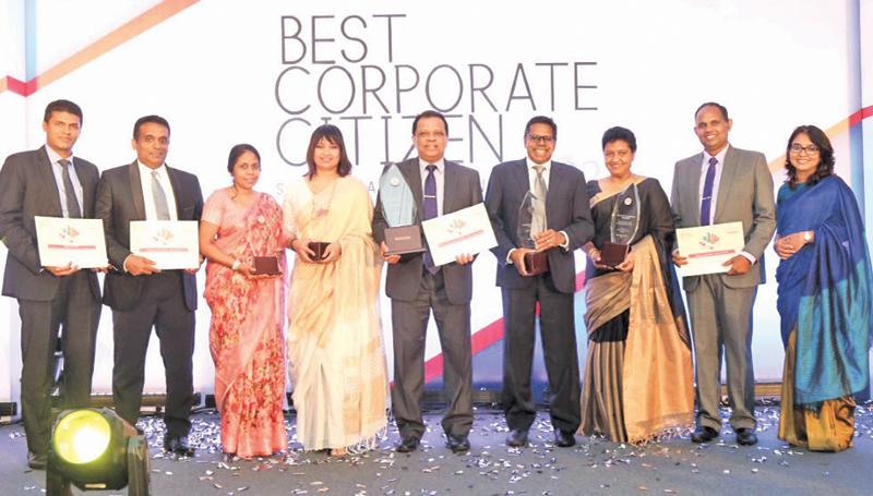 From left: Head of Marketing, Upul Adikari, Executive, Sustainable Business, Shanel Perera, Head of Legal /Board Secretary Shiromi Halloluwa, Chief Human Resource Officer/DGM – Human Resources, L. Chiranthi Cooray, Managing Director/CEO Jonathan Alles, Executive Director/COO Dilshan Rodrigo, Assistant General Manager - Risk, Dilunika Jayasinghe, Assistant Manager, Sustainable Business, Hemantha Senanayake and Assistant General Manager, Strategy of HNB, Priyanka Wijeratne with the awards.
