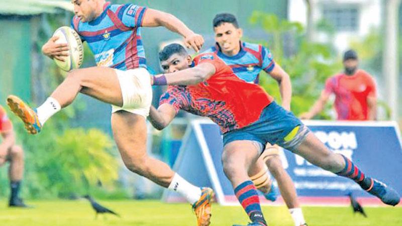 Air Force player Saraka Werralla averts a tackle from CR player Soyura Anthony in their first round League rugby match last week