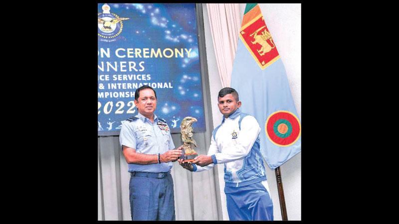 Most Valuable Player who represented the water polo team Leading Aircraftman RLK Udayathra receiving his Award from the Commander of the Air Force Air Marshal Sudharshana Pathirana at the felicitation ceremony held at the Air Force headquarters in Colombo