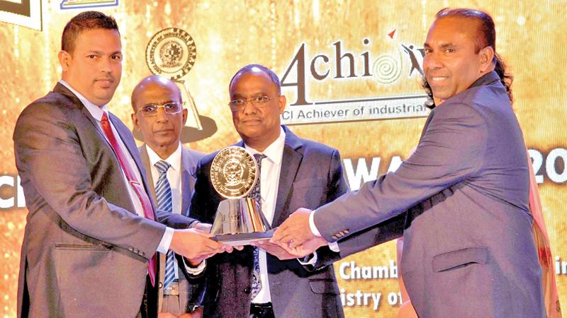 Executive Director Travis Ferreira and Regional Manager of Exterminators, Sajith Bandara receiv the award