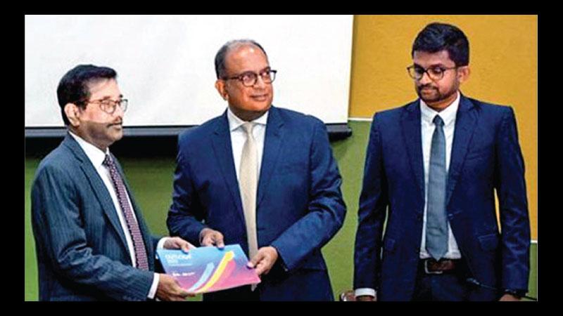 Chairman CCC, Vish Govidasamy presents the report to CB Governor Dr. Nandalal Weerasinghe 