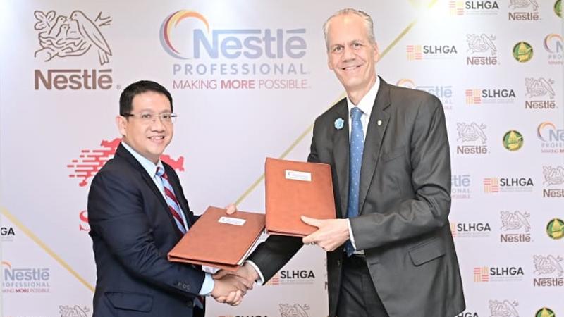 Rolf Blaser, MD and CEO of Baurs (right) exchanging the agreement with Jason Avanceña, Managing Director of Nestlé Lanka PLC