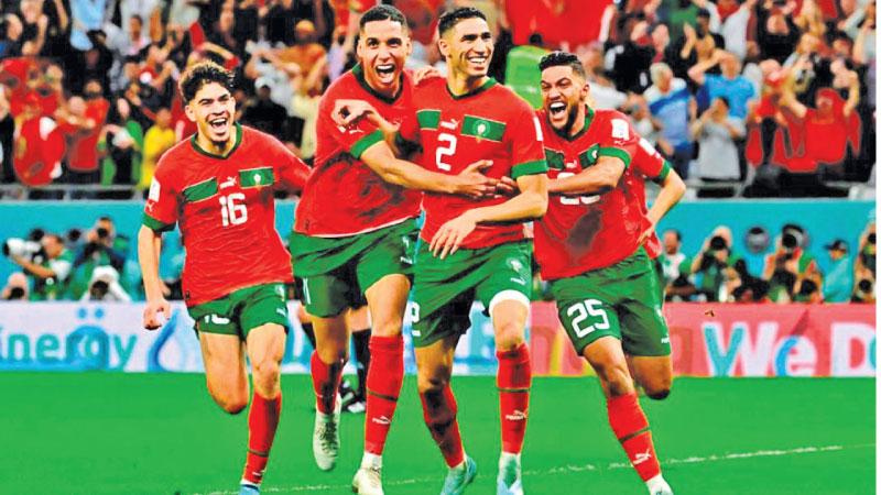 Achraf Hakimi (No. 2) celebrates a victory at World Cup