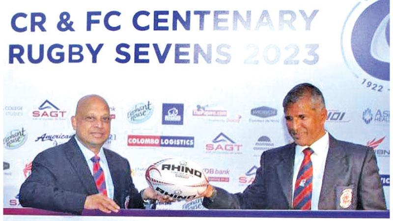 Tournament Director Dilroy Fernando (right) presents a rugby ball to CR and FC president Ted Muttiah in the build up to their centenary celebrations (Pic by Sudath Malaweera)