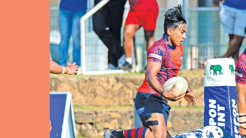 CR and FC full back Mursheed Doray makes a break in their match against Navy SC