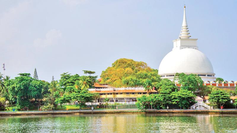 The Kalutara Dagaba rises majestically on the bank of the Kalu Ganga