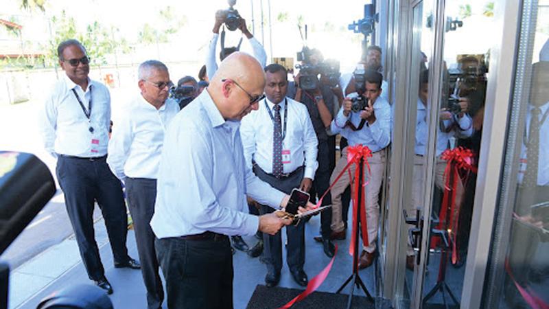 Group Chairman, Cargills (Ceylon) PLC, Louis Page opens the Cargills Distribution Centre in Katana. Group Deputy Chairman Ranjit Page and officials look on. Pic: Wimal Karunathilaka