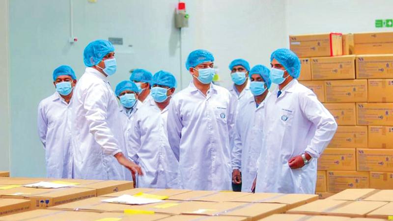 State Minister Dilum Amunugama, BOI and company officials at the pharmaceutical facility.
