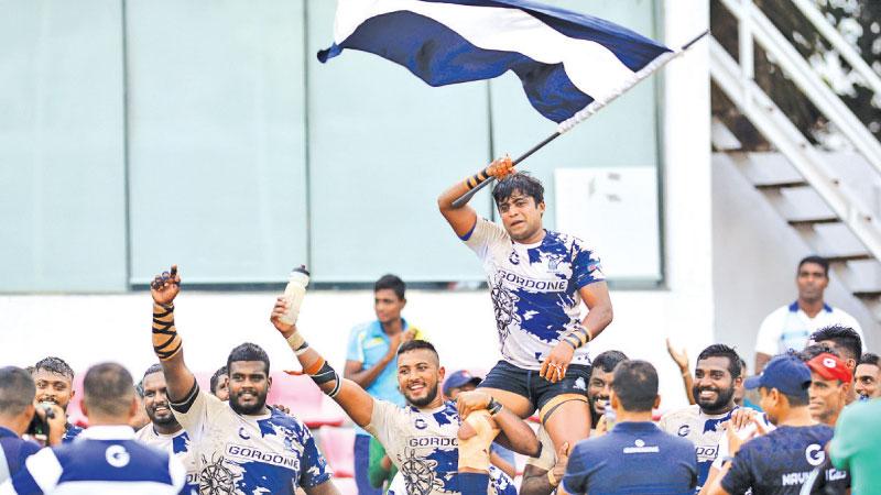 Radeesha  Seneviratne is carried by his Navy team mates after yesterday’s farewell match  (Pic: Sudath Nishantha)