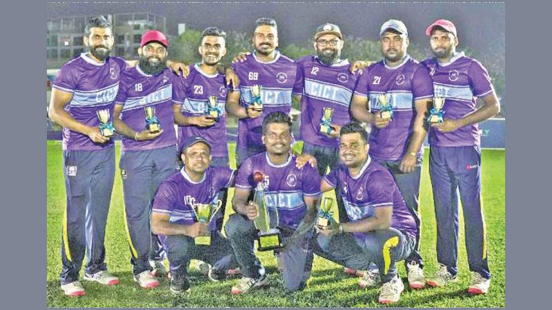 The champion cricket Sixes team of Colombo International Container Terminals (CICT) comprising Anju Jayashantha (captain), Asanka Chamara, Sharika Lakmal, Madusha Randunu, Madusha Lakshan and Angelo Johns pose with their trophy along with reserve mates