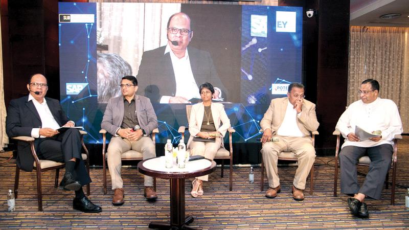 The panellists, Chairman, ICTA, Prof. Malik Ranasinghe, Independent Director, SLID, Dr. Kithsiri Manchanayake, PWC Sri Lanka, Director Ruvini Fernando and M.R. Anoop of SAP.