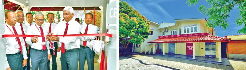 Ceylinco Life Chairman R. Renganathan, Managing Director Thushara Ranasinghe and officials at the opening of the refurbished Green branch in Nugegoda (right).
