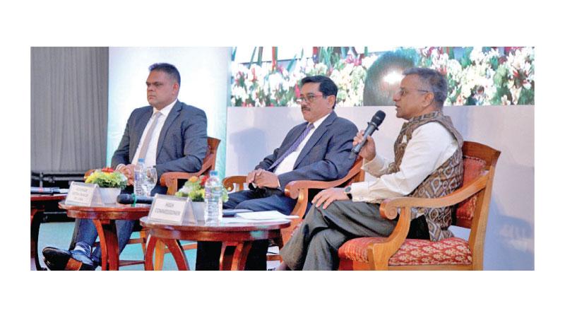 State Minister Shehan Semasinghe, High Commissioner Gopal Baglay and Central Bank Governor Dr. P. Nandalal Weerasinghe