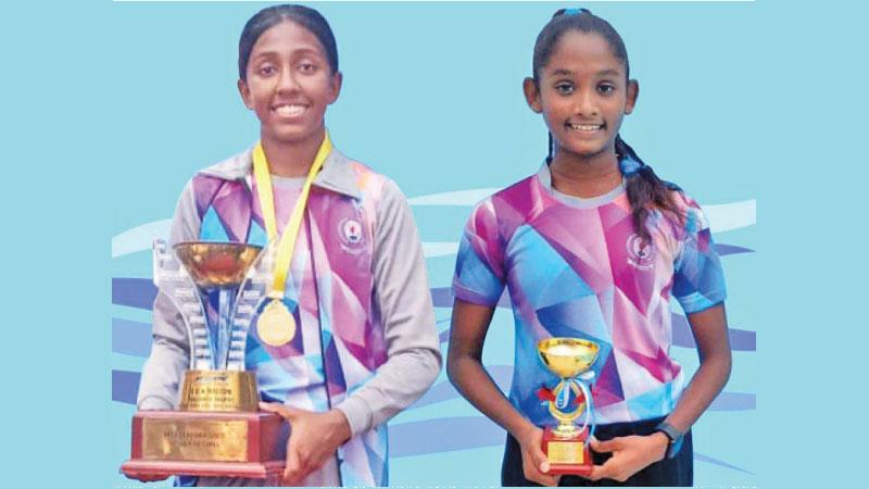 Ginuki Tharulya (left) and Piyumi Maleesha pose with their trophies