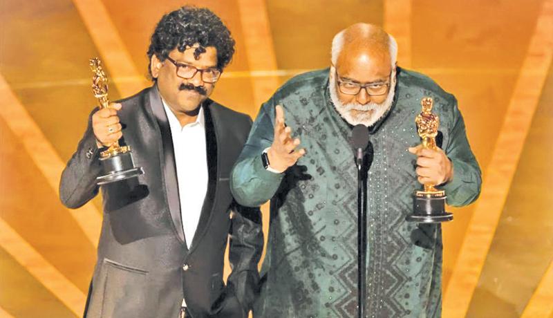 M.M. Keeravani (R) and Chandrabose (L) win the Oscar for Best Original Song for “Naatu Naatu” from “RRR” during the Oscars show at the 95th Academy Awards in Hollywood