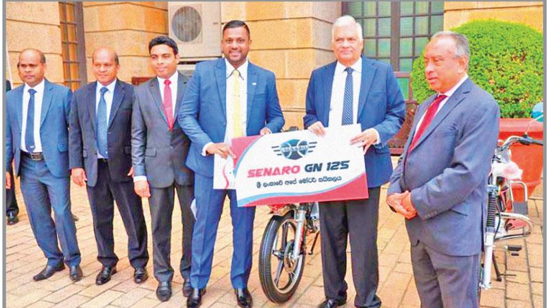 President Ranil Wickremesinghe  at the presentation of several motorcycles assembled in Sri Lanka with the support of the Bank of Ceylon,  to the Presidential Secretariat