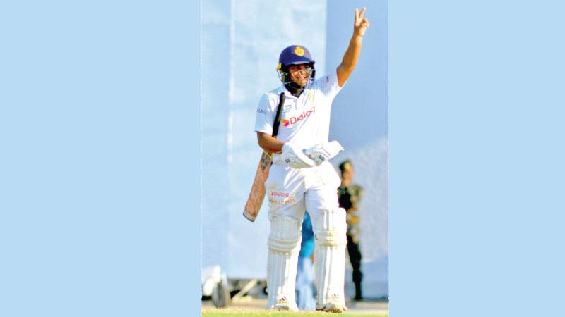 Dasis Manchanayake acknowledges his century  against S. Thomas’ College Pix by Chinthaka Kumarasinghe