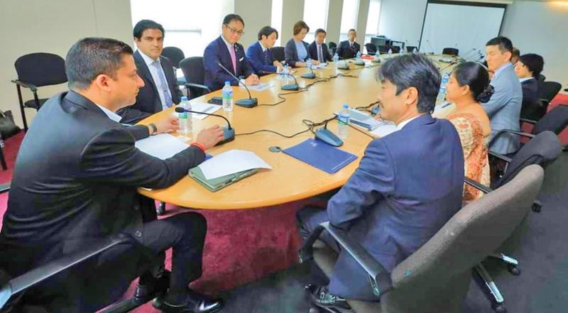 State Minister Dilum Amunugama and BOI officials with the Japanese investors