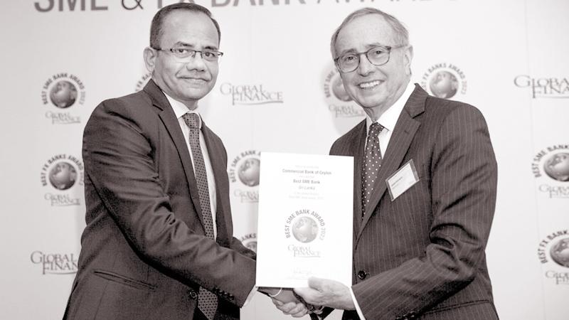 Commercial Bank’s Chief Operating Officer S. Prabagar (left) receives the award at the Best SME Bank awards ceremony in London.