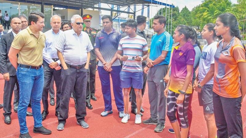 President Ranil Wickremesinghe speaking to athletes and officials during his inspection visit to Diyagama Mahinda Rajapaksa stadium.