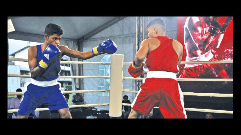 Umayanga Mihiran (red) during his exhibition bout