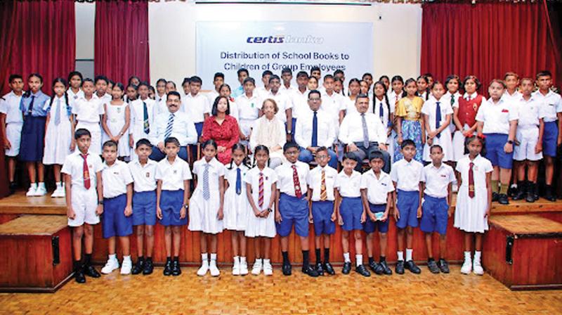 Seated from left: Deputy Chairman Vipul Hettige, Joint Group Managing Directress Ms Minoli Wijesinghe, Chairperson Ms Asanti Wijesinghe, Joint Group Managing Director Jeevaka Wijesinghe and Group Director / Chief Operating Officer - Major Ananda Rodrigo with the children of the employees.
