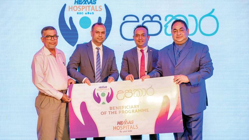 Presentation of the Upakara offer: From left: Beneficiary of the program Ruwan Nishantha, Director General Manager Prabhan Gunawardena, Director General Manager Dr Pradeep Edward and Managing Director Dr Lakith Peiris