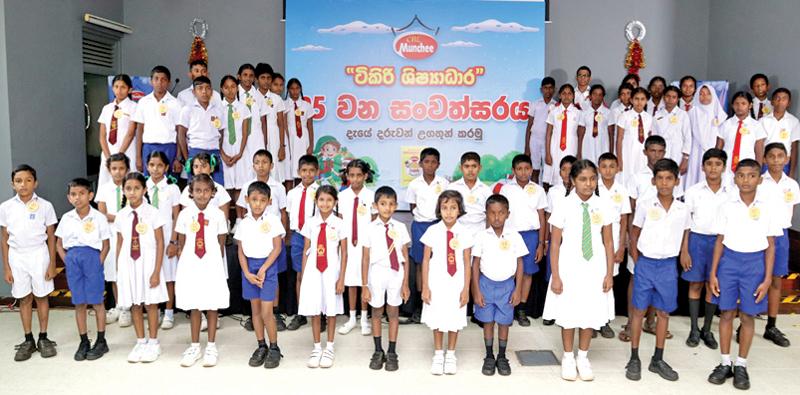 Fifty Shishyadara recipients at  the Munchee factory