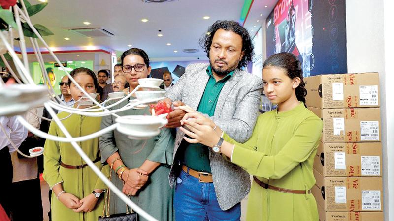 Founder and CEO of sell-X Computers Sameera Bopage and family members open the new head office and showroom