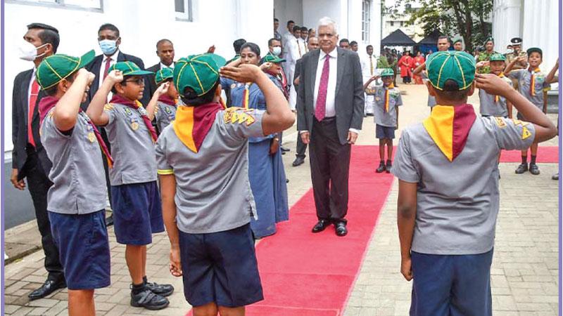 President Ranil Wickremesinghe who was the chief guest at the Ananda College prize-giving being welcomed by  scouts of the school. Pic: President’s media