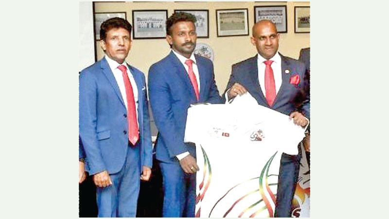 Sri Lions Sri Lanka Founder Kelum Sujith Perera (right) making a jersey presentation to Sri Lanka rugby captain Srinath Sooriyabandara (left) in the presence of motor racing icon Dilantha Malagamuwa