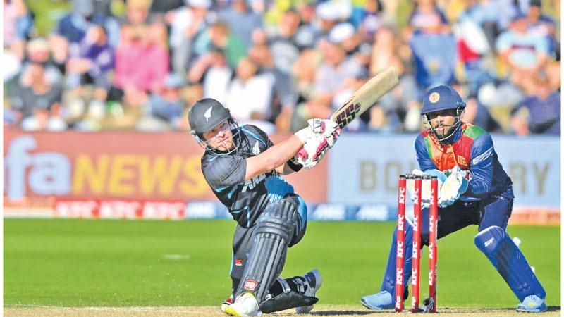 New Zealand batsman Tim Seifert hits a six during his innings of 88 watched by Sri Lanka wicket-keeper Kusal Mendis (Pix SLC)