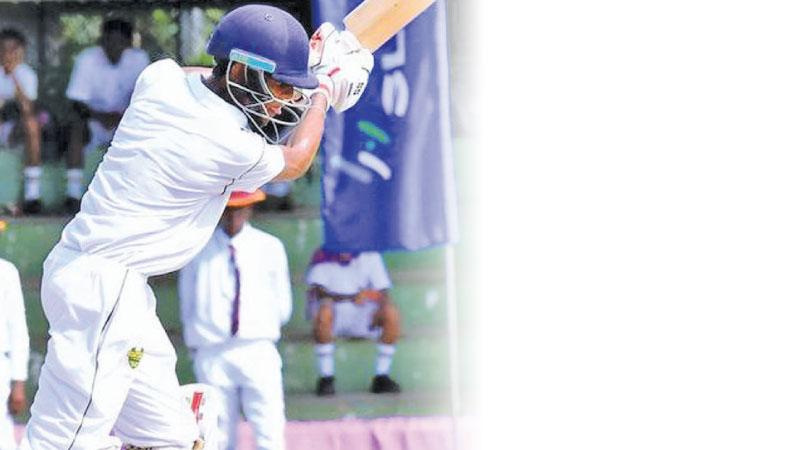 St. Sebastian’s College batsman Vimath Dinsara drives a ball to the boundary on his way to a century in their Battle of the Golds match against Prince of Wales College at the De Soysa Stadium in Moratuwa yesterday (Pic by Gayan Pushpika)