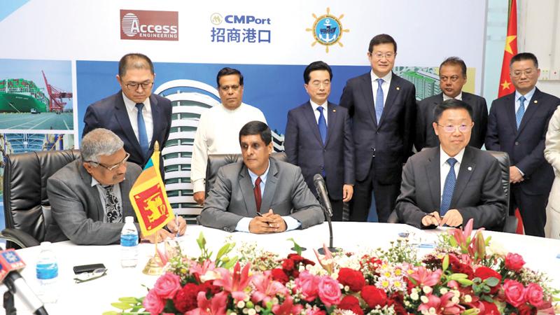 Minister Nimal Siripala De Silva, Chairman of China Merchants Group, Miao Tianmin, Chairman Access Group Sumal Perera with  officials at the event.  Pic: Shirajiv Sirimane