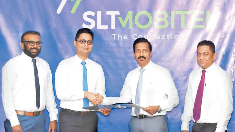From left: Director, Stemup Foundation, Sameera Prajapriya and Chairman, Stemup Foundation, Prabhath Mannaperuma, exchange the agreement with SLT-Mobitel GCMO Prabhath Dahanayake and General Manager, Marketing Services, SLT, Anuruddha Suriarachchi