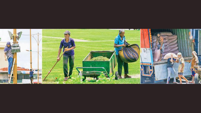 While preparations are underway for today’s May Day celebrations, workers in Pettah and several areas in Colombo were seen toiling for a living as usual yesterday. Pictures by Sulochana Gamage