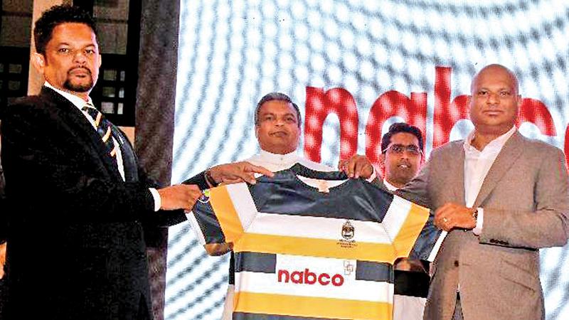 Mangala Dharmapriya (left-president St. Peter’s College Rugby Foundation) presents Trishan Satyadheva the Managing Director of Nabco UK the rugby team’s new jersey in the presence of the school’s rector Fr. Rohitha Rodrigo and prefect of games Fr. Milan Bernard 