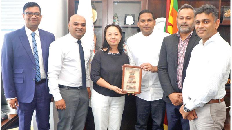 Minister of Tourism Harin Fernando and officials with General Manager of Air China, Colombo, Emily Liu