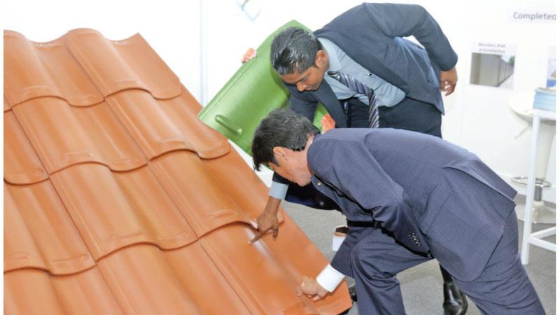 Japan’s Acting Ambassador Kotaro Katsuki takes a keen interest in roofing tiles made in Sri Lanka.