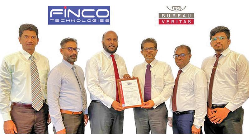 CEO Finco Technologies, Ruwan Bandara (fourth from right) receives the ISO 9001:2015 certification from General Manager Shan Nanayakkara. Looking on (from left) are: AGM, Business Process Management, Chrishantha Tissera and General Manager,  Operations Sujith Dodamgaslanda of  Finco Technologies, Manager, Marketing and Sales Certification Service Line, and Subash de Silva, Business Development Executive, Certification Services and Basith Ali of Bureau Veritas Lanka. 
