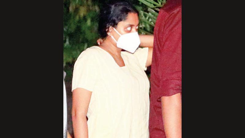 Natasha Edirisuriya being escorted out of the Magistrate’s residence yesterday.Picture by Sulochana Gamage