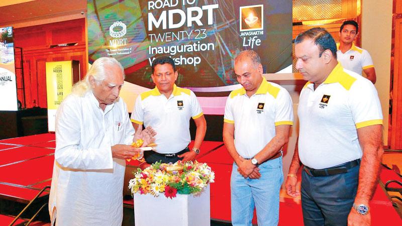 Founder and Chairman Emeritus of the Janashakthi Group, C.T.A. Schaffter lights the oil lamp.