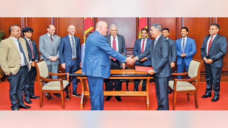 Power and Energy Ministry Secretary Mapa Pathirana signed the agreement with RM Parks Company Vice President Justion Divis in the presence of President Ranil Wickremesinghe, Power and Energy Minister Kanchana Wijesekera, Foreign Affairs Minister Ali Sabry, PC, State Ministers D. V. Chanaka, Indika Anuruddha, Shehan  Semasinghe, Presidential Senior Advisor on National Security and Chief of Presidential Staff Sagala Ratnayake and American Ambassador to Sri Lanka  Julie Chung.