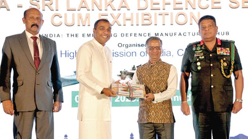 State Minister of Defence Pramitha Bandara Tennakoon, Indian High Commissioner Gopal Baglay and others at a book launch at the defence seminar