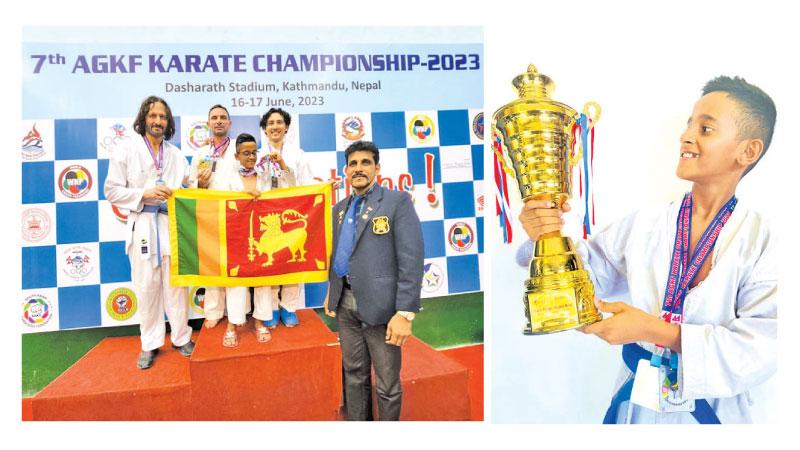 Sethindu Vinuwan (third from left) stands on the podium with his three Australian supporters and coach Damith Bandara (right)-Sethindu Vinuwan with his prized trophy