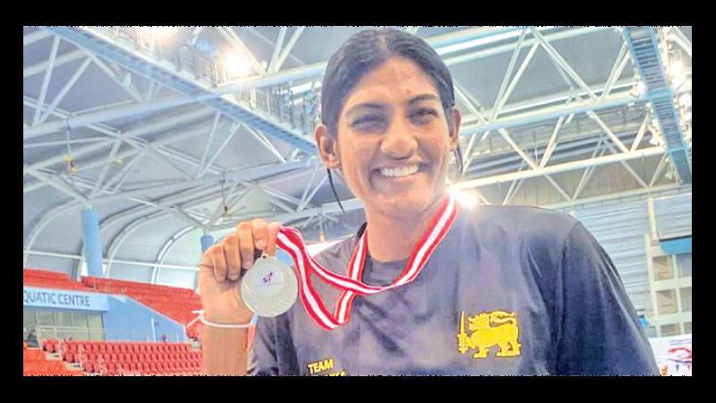 Ganga Seneviratne shows off her medal