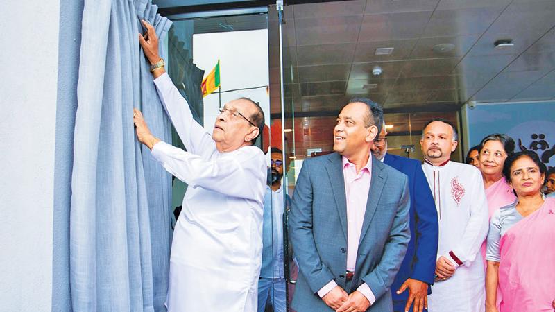 The plaque being unveiled at the ceremonial opening of Suwa Arana by former Speaker Karu Jayasuriya while others look on